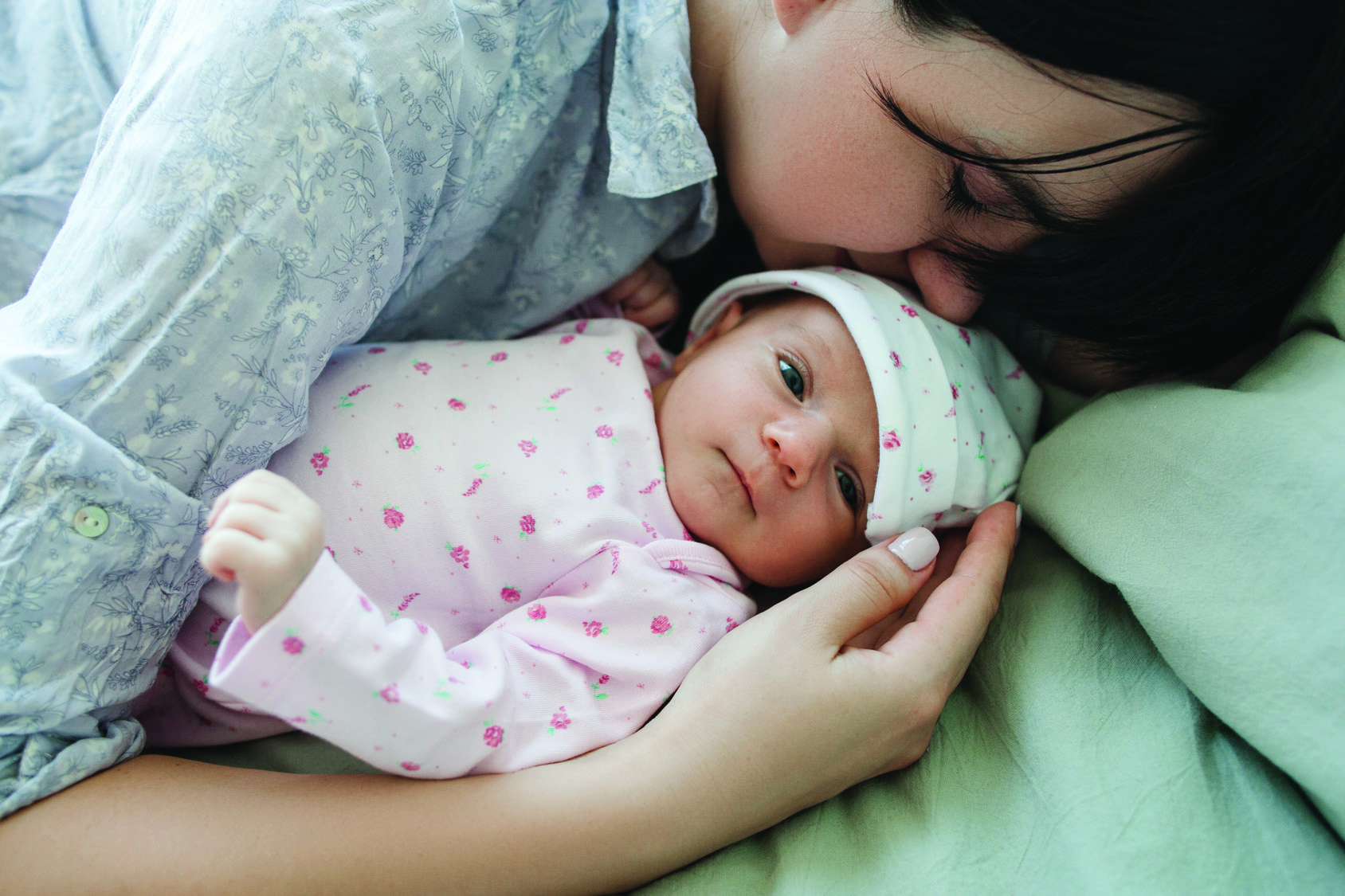 a mother's daytime sleep with her newborn baby