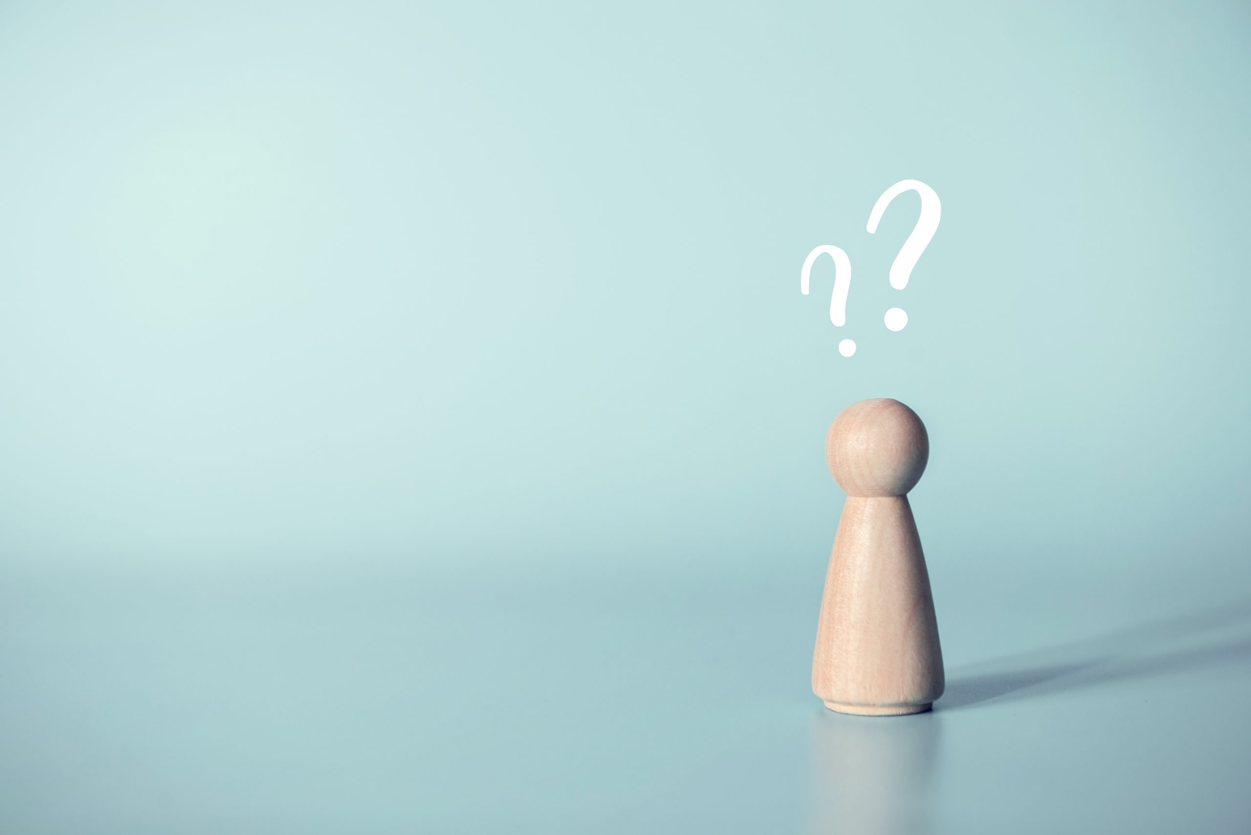 Human with a question mark icon on blue background, copy space.